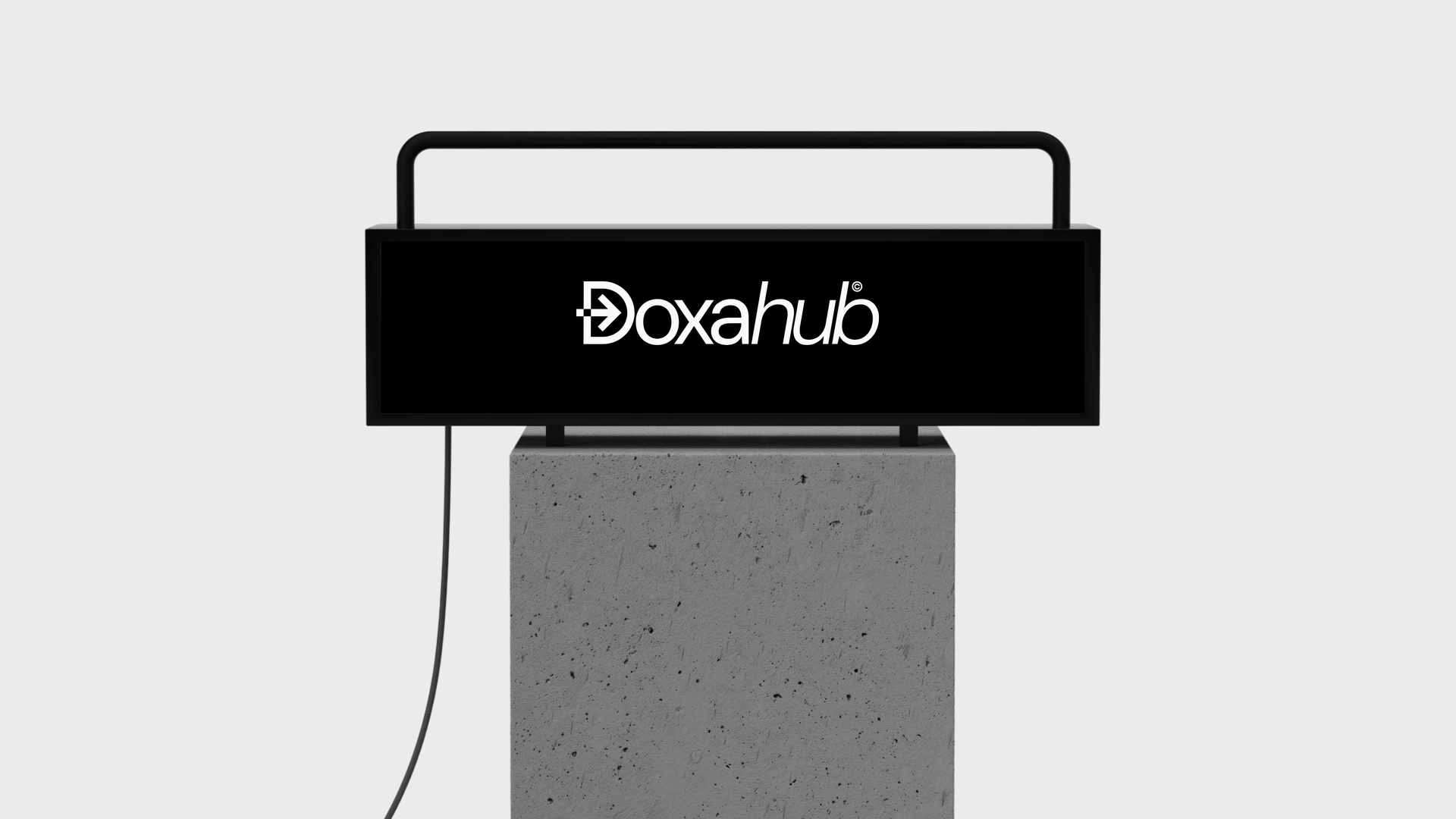 Lightbox with the DoxaHub mark on a concrete base
